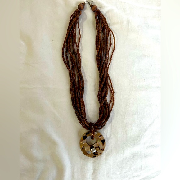 Jewelry - Brown beaded necklace with medallion